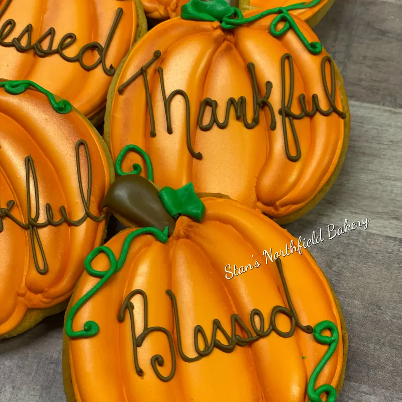 Pumpkin cookies lettered thankful and blessed