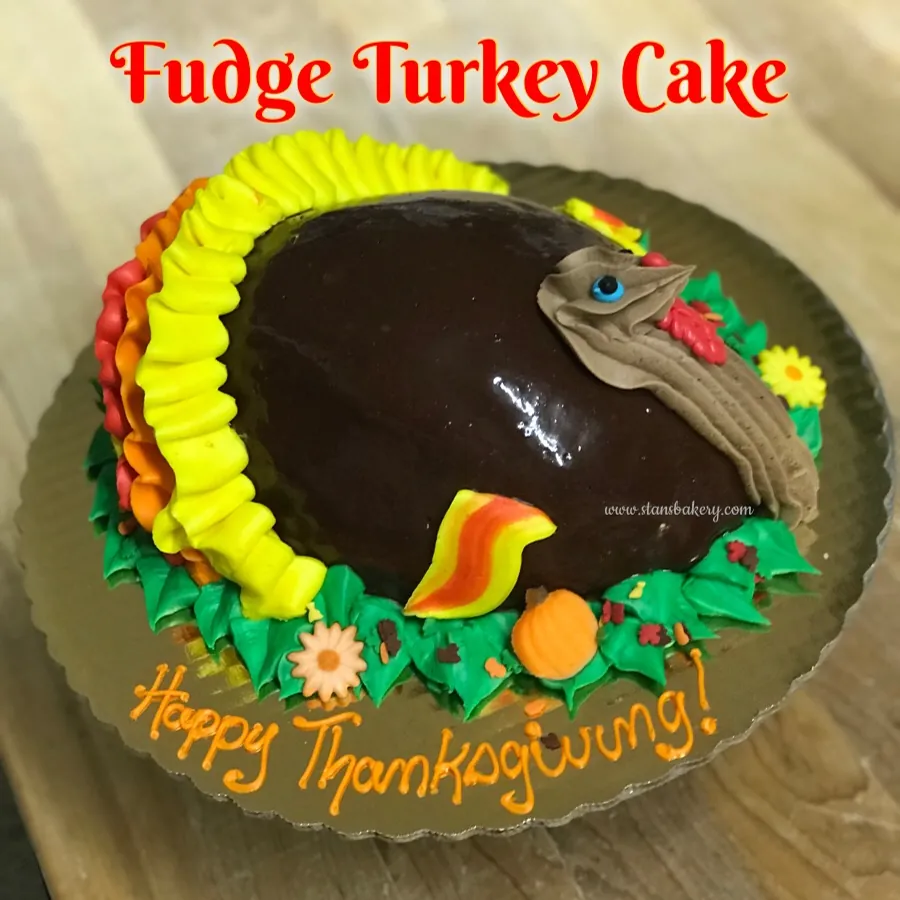 A fudge turkey cake lettered Happy Thanksgiving