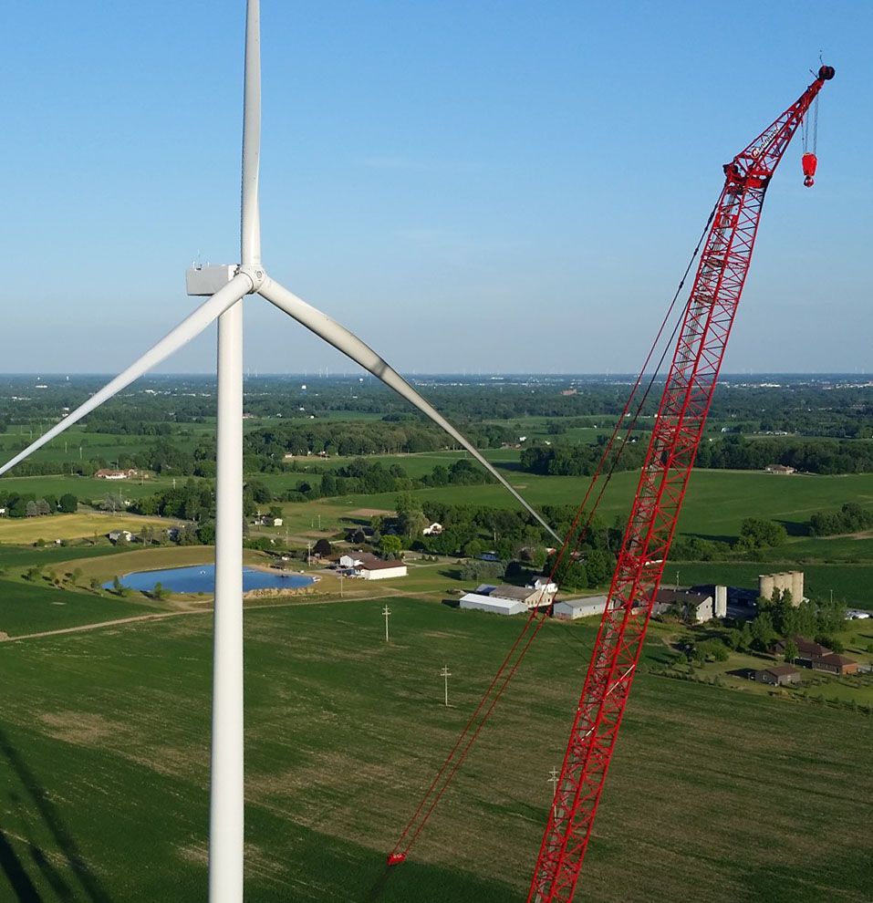 Wind turbine with crane during construction