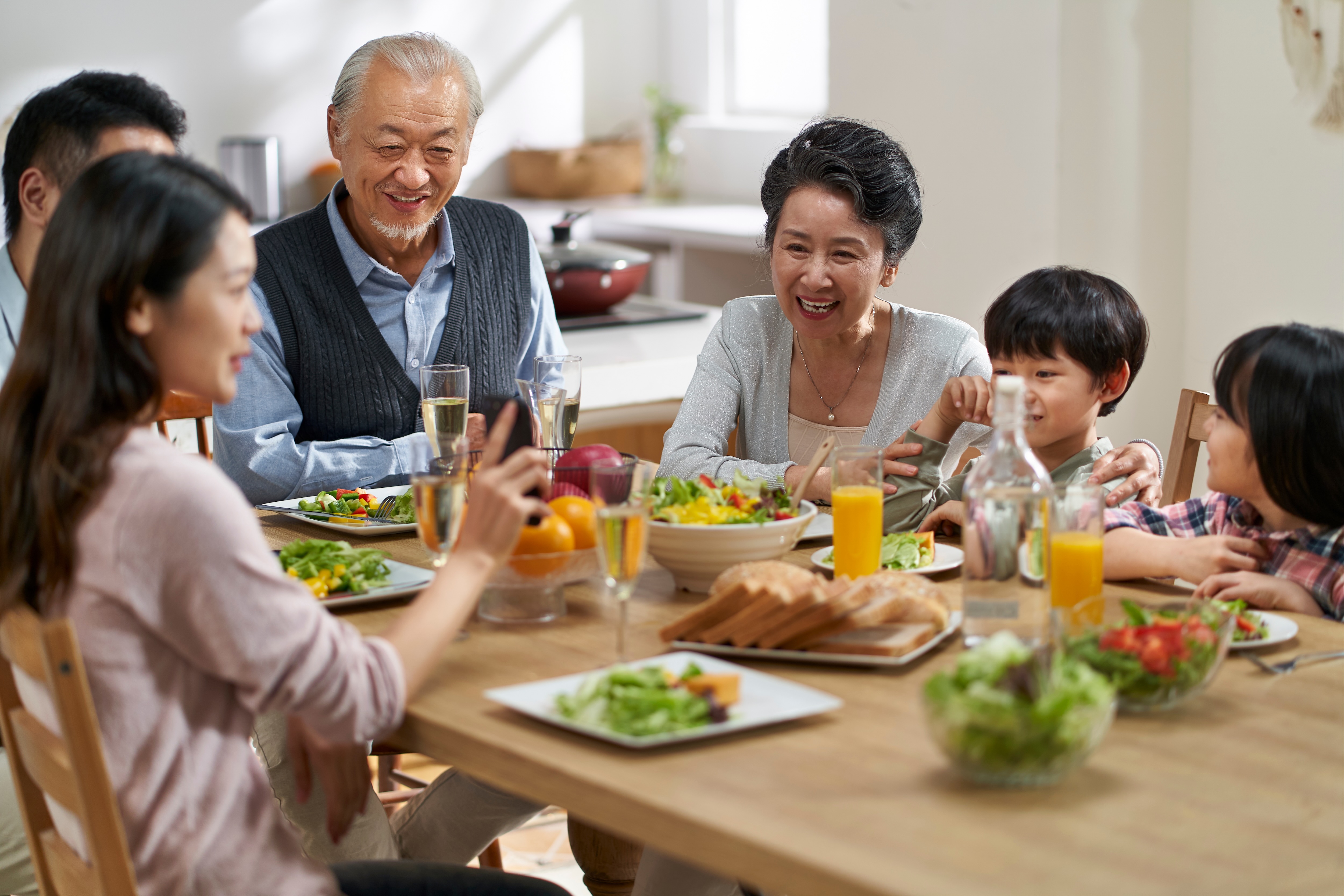 Family eating at table stock image