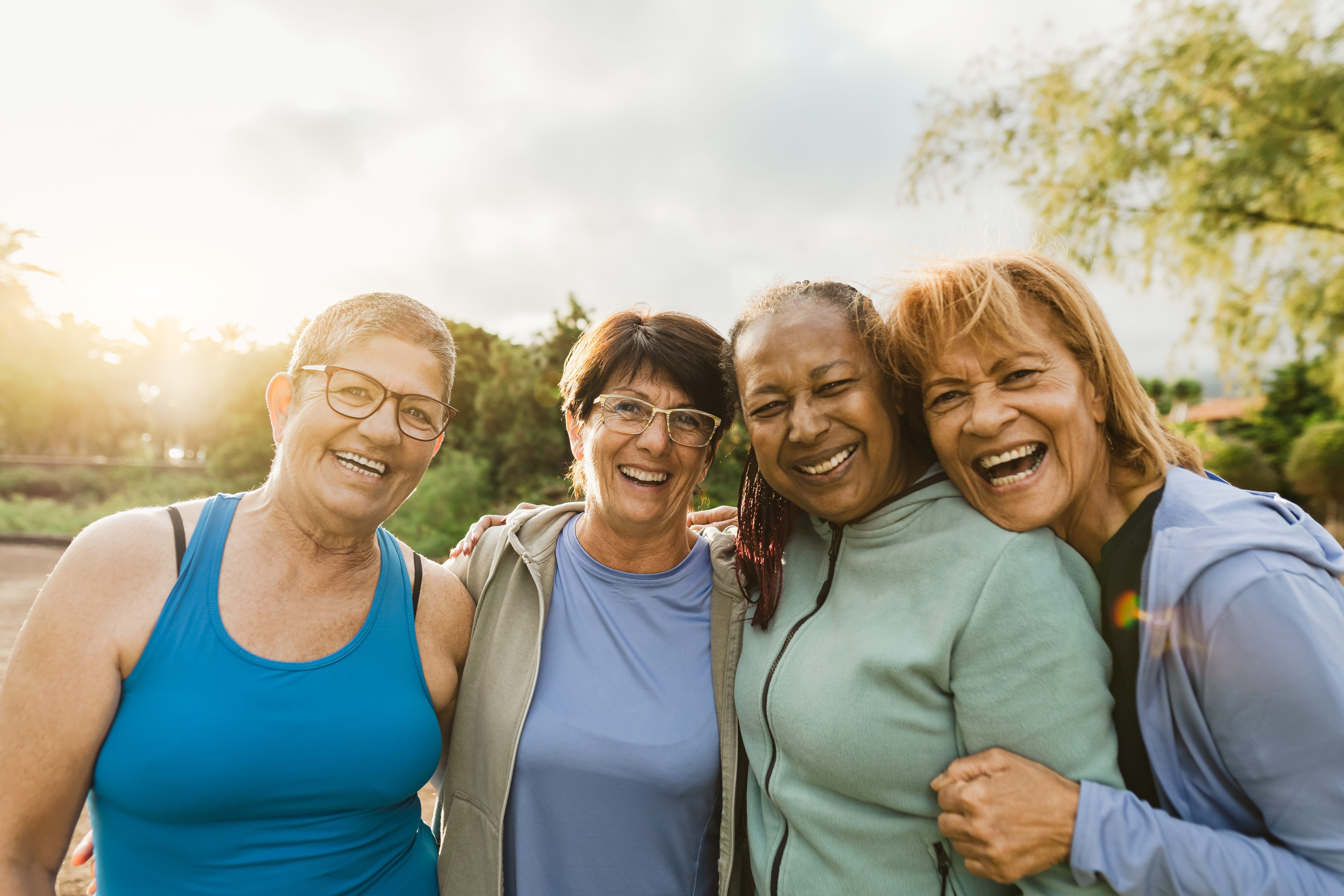 Women smiling outside stock image