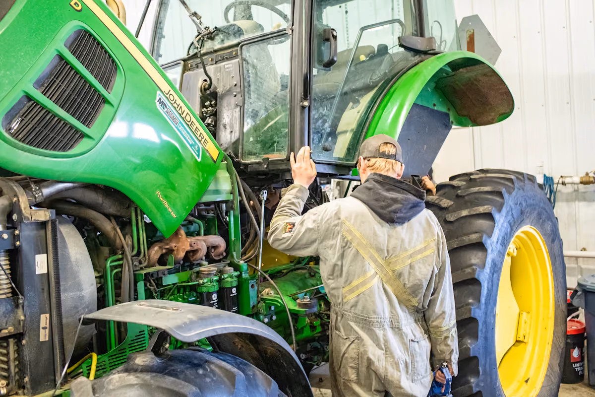 Mechanic performing farm equipment repair in Saginaw, TX