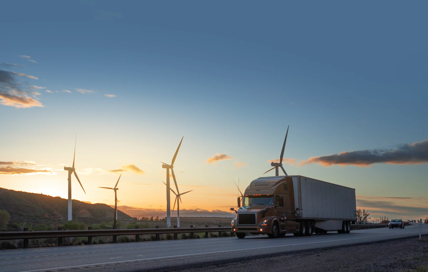 Freight truck on a highway at sunset