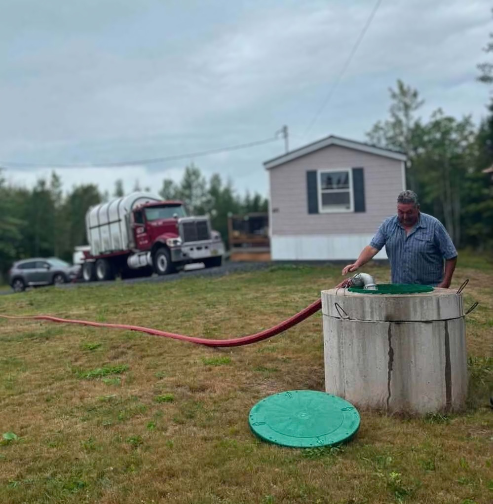 AN image of a man filling a cistern with water n a residential property