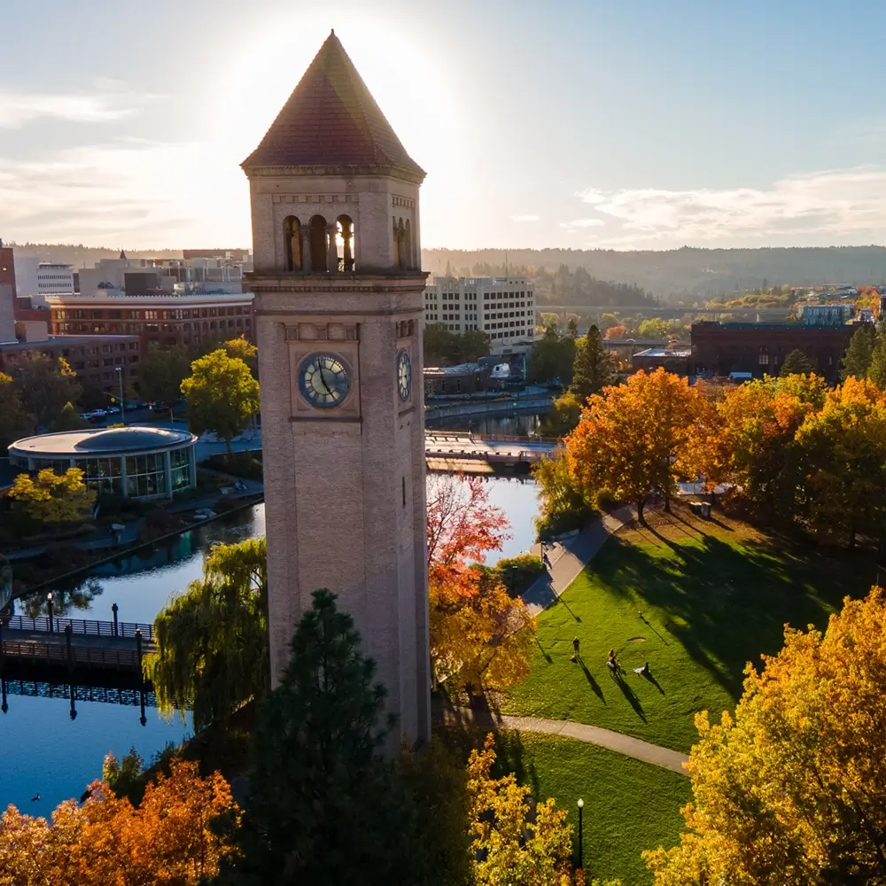 Downtown Spokane Riverfront Park in autumn with tall clock tower