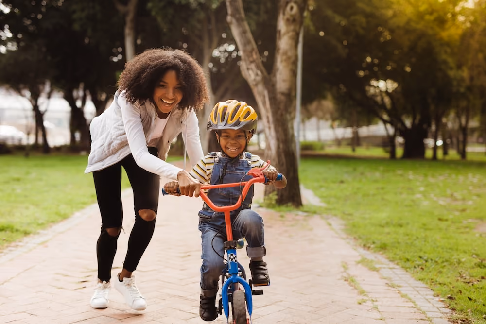 Woman riding bike with her child