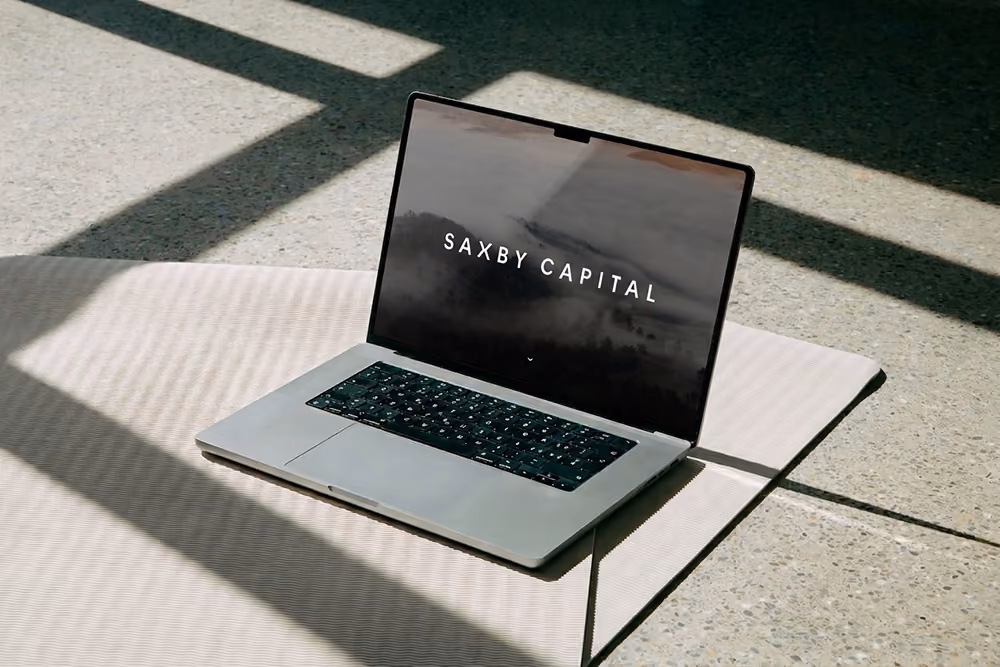 Laptop displaying the Saxby Capital website