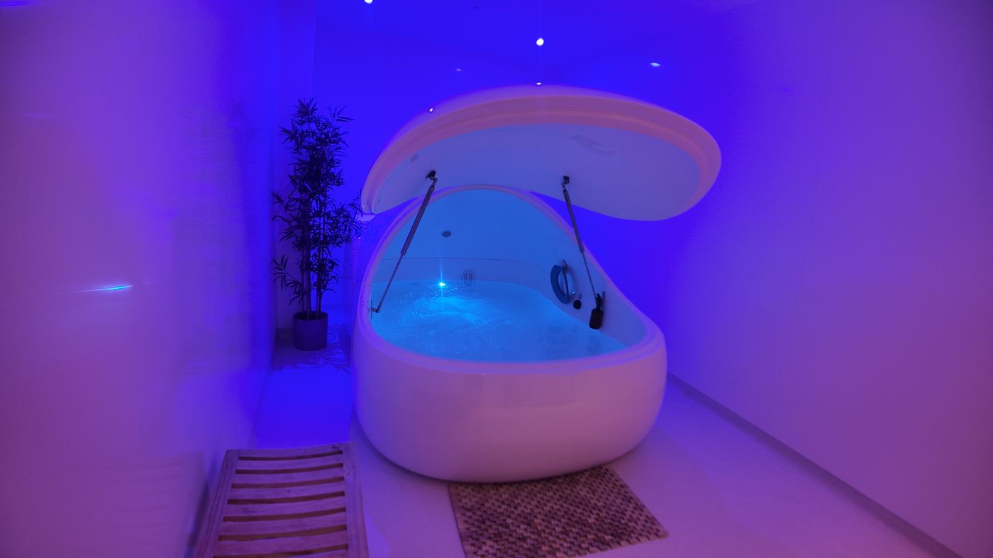 A float pod lit in blue with the lid open