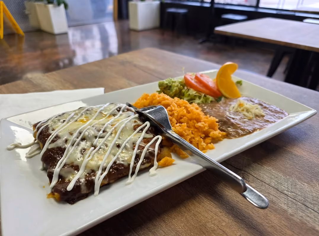Cheese enchiladas plate with rice, refried beans, and pico de gallo at Don Chuy's