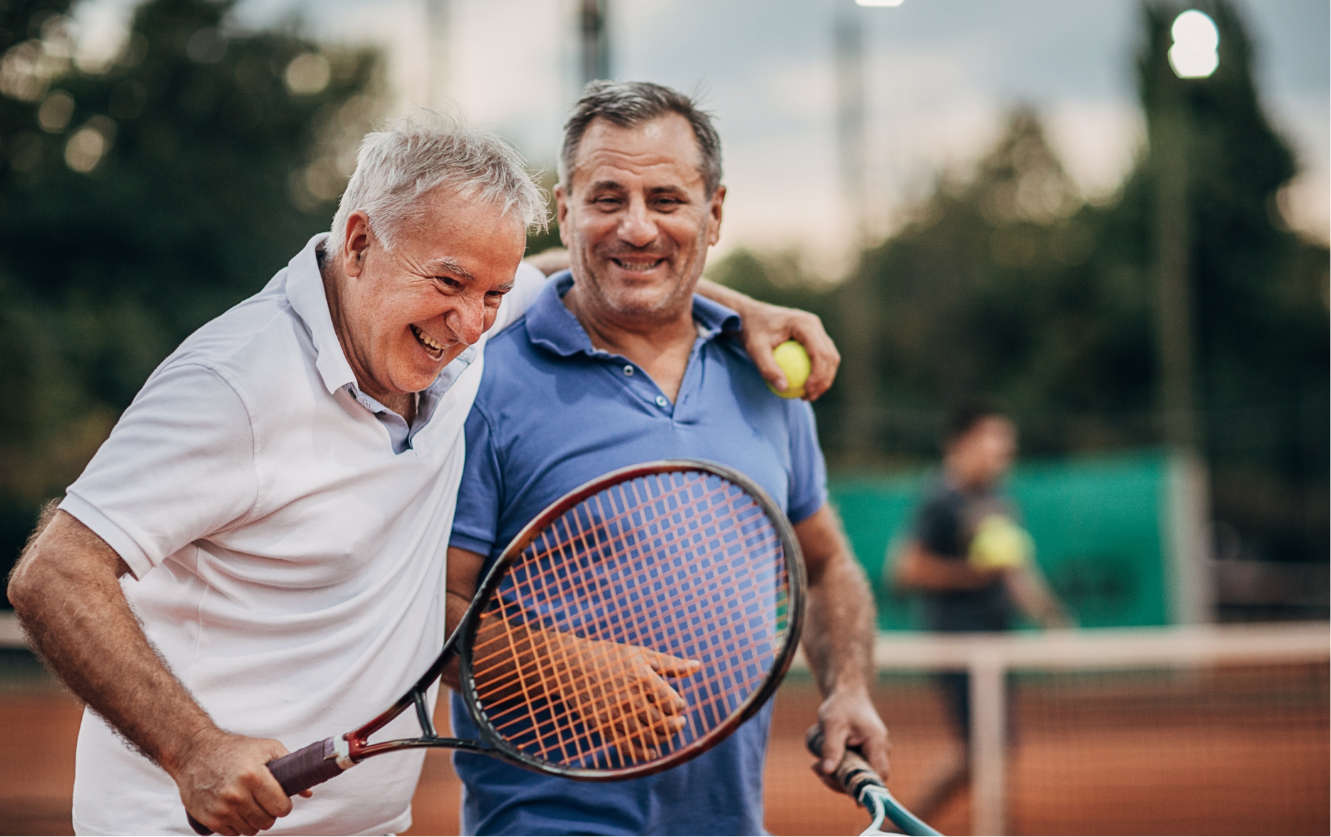 senior men playing tennis