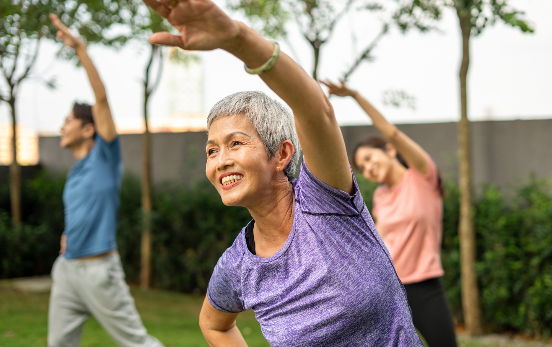 seniors stretching in a group fitness class