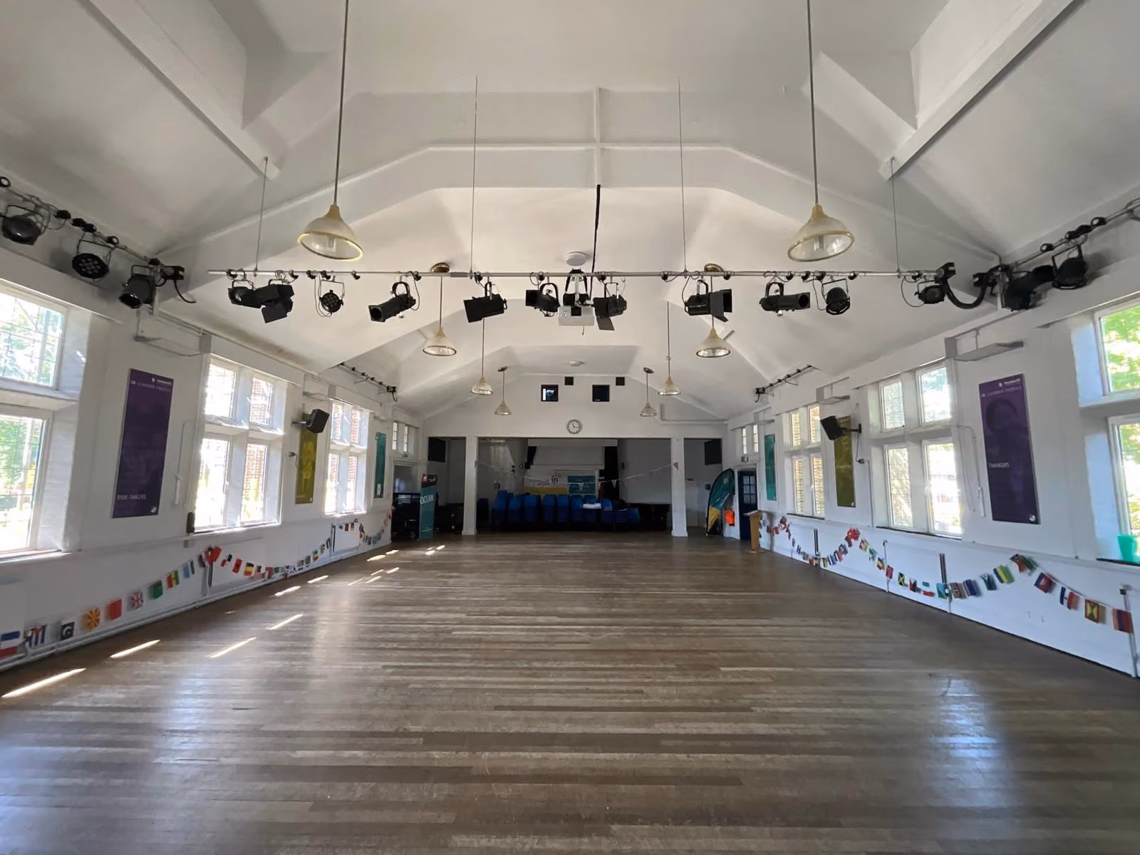 Empty community hall interior being assessed for acoustic treatment