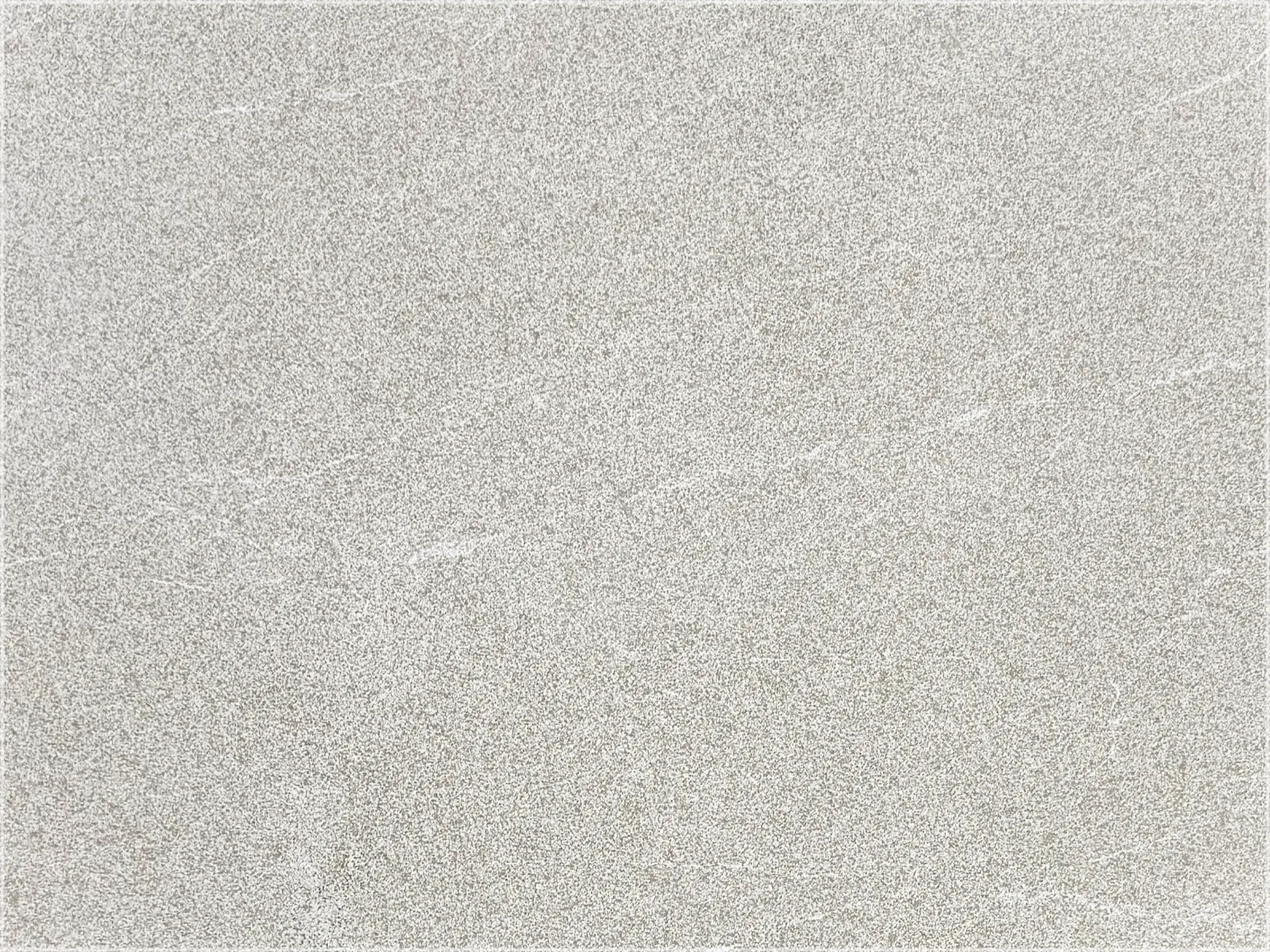Tuscany Beige marble paver with a light beige surface and fine gray mottling.