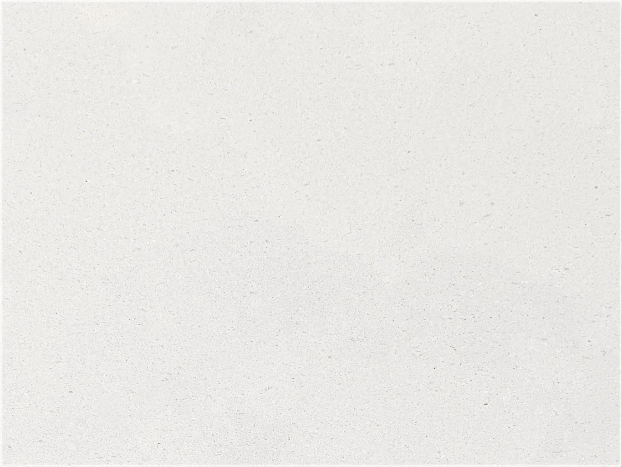 Close-up of Classic Limestone with a soft ivory background and fine cream and light gray speckling.