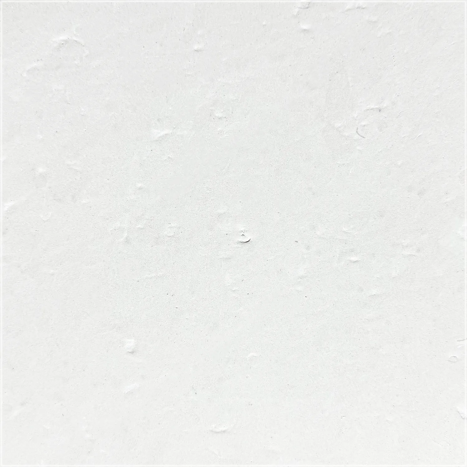 Cloudy Limestone tile with a brushed finish, showing a textured off-white surface with small natural indentations.