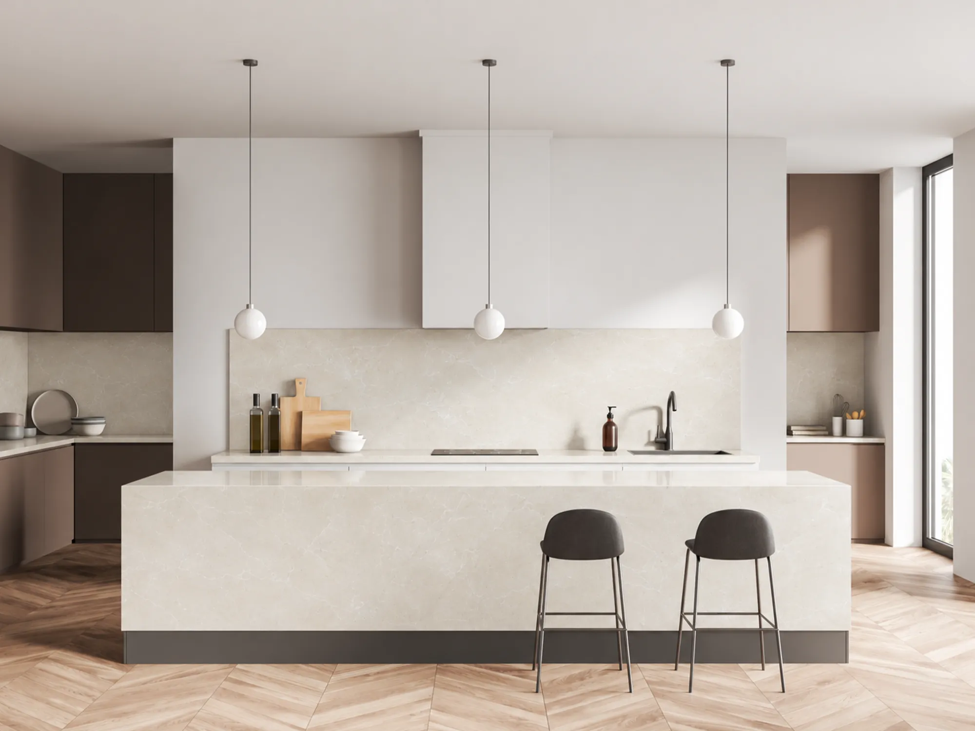 Burdur Beige marble kitchen island and backsplash with brown cabinetry, black bar stools, and a wood floor.