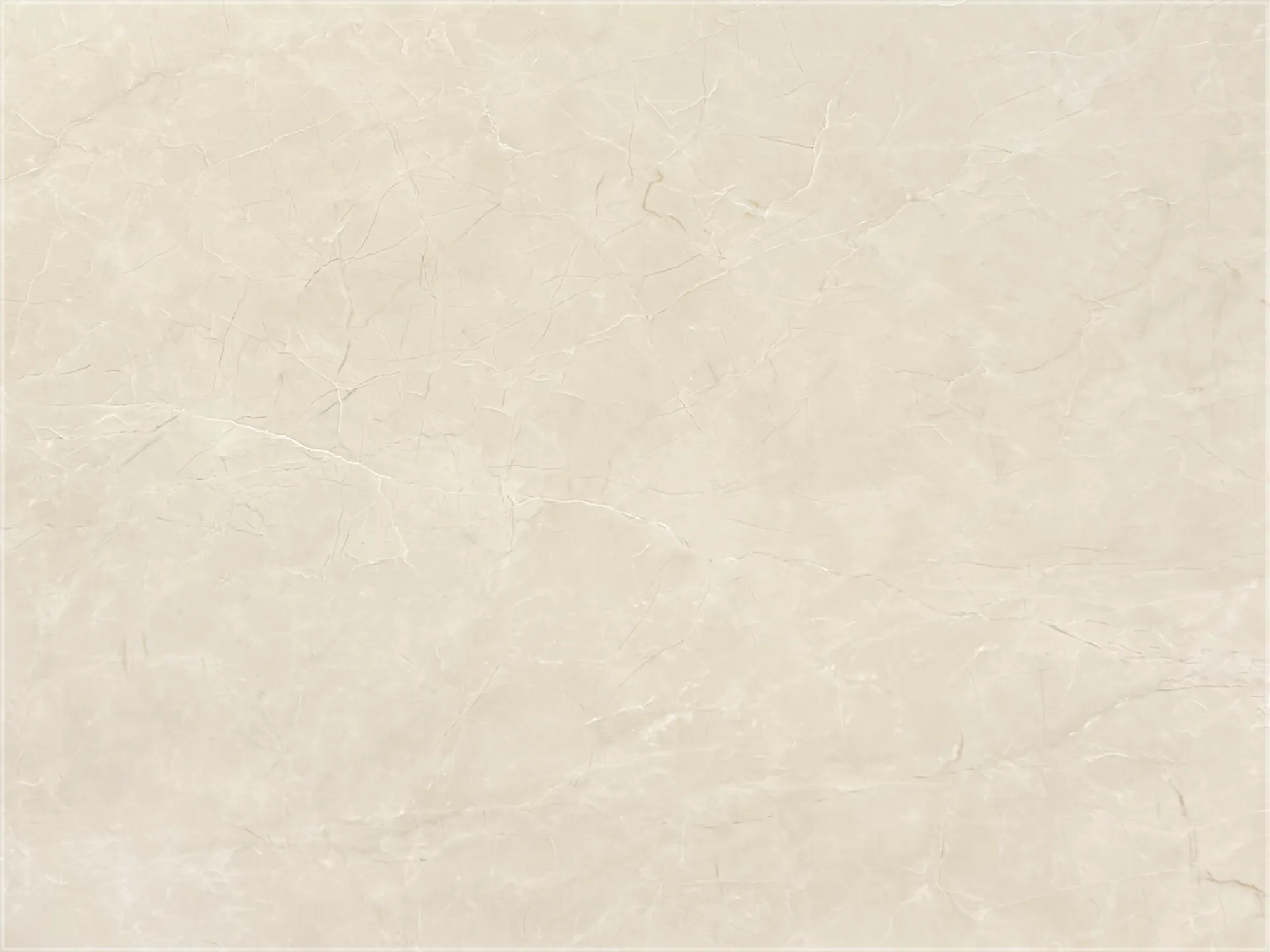 Close-up of Sundein Beige marble with a warm cream background, intersecting white and gray veins, and subtle tan accents.