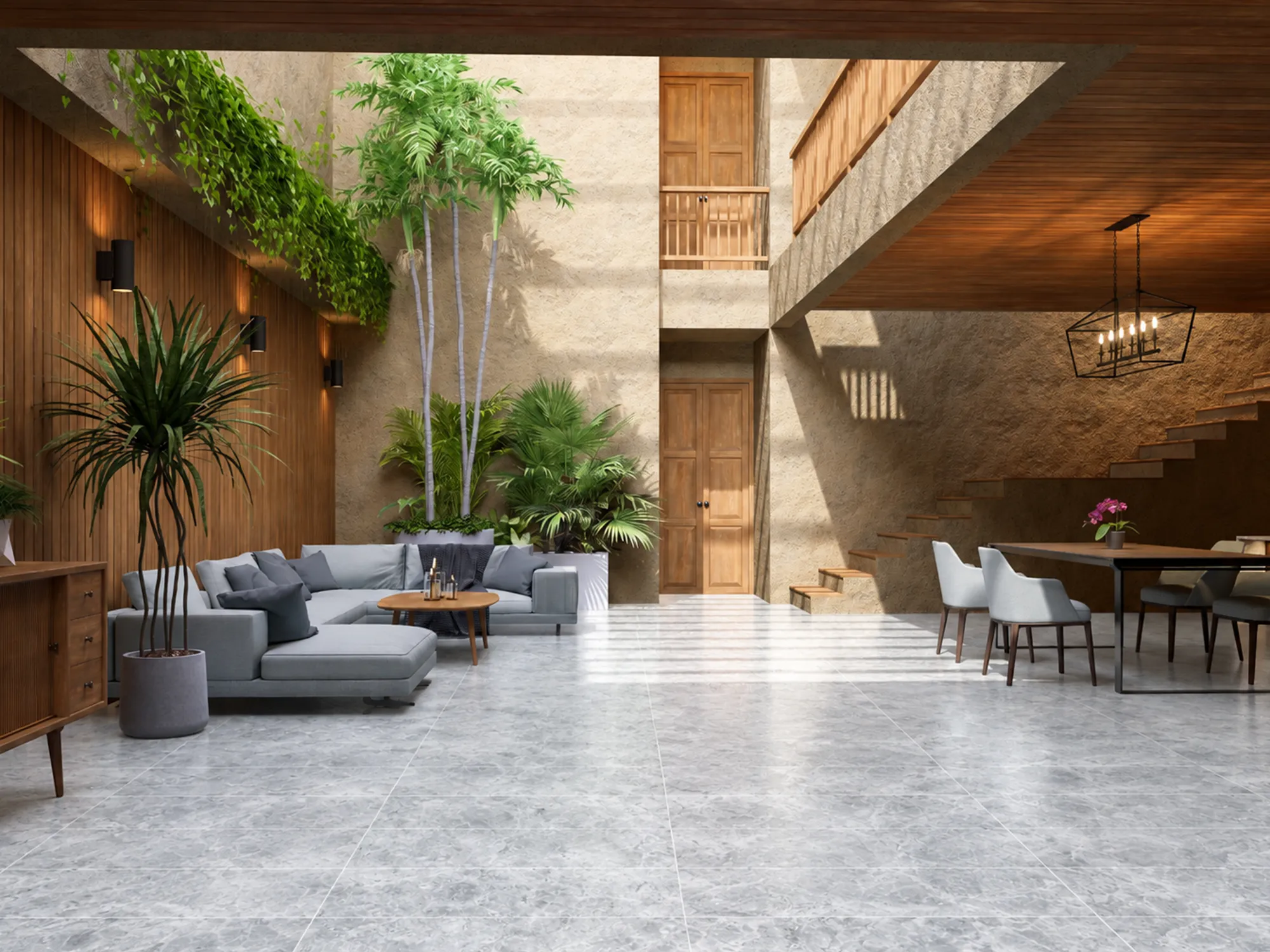 Tundra Grey marble floor tiles in a bright double-height living and dining room with wood accents and indoor plants.