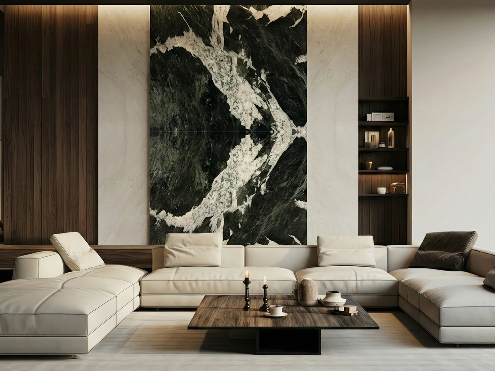 Verde Tinos marble feature wall with bold white veining behind a cream sectional sofa, framed by pale panels and dark wood.