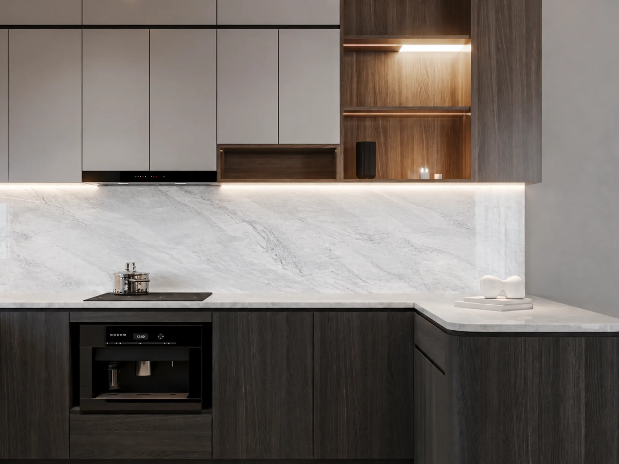 Mugla White marble kitchen countertop and backsplash with soft gray veining, dark wood cabinets, and illuminated shelving.