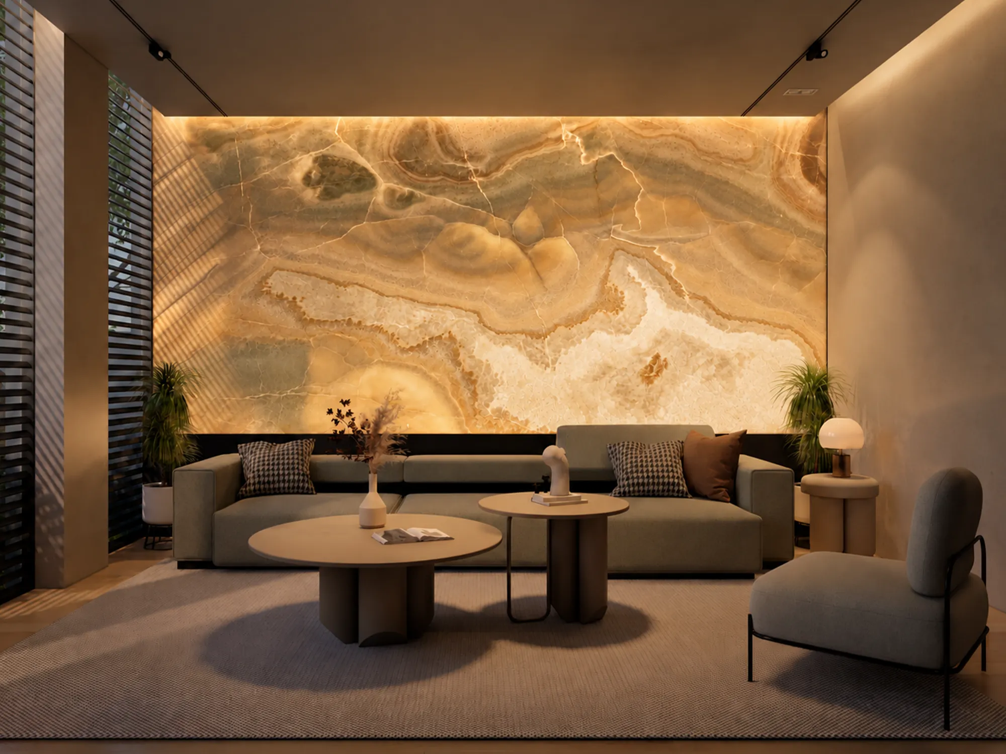 Backlit Honey Onyx feature wall with warm golden tones and ivory patterns behind a neutral sofa in a living room.