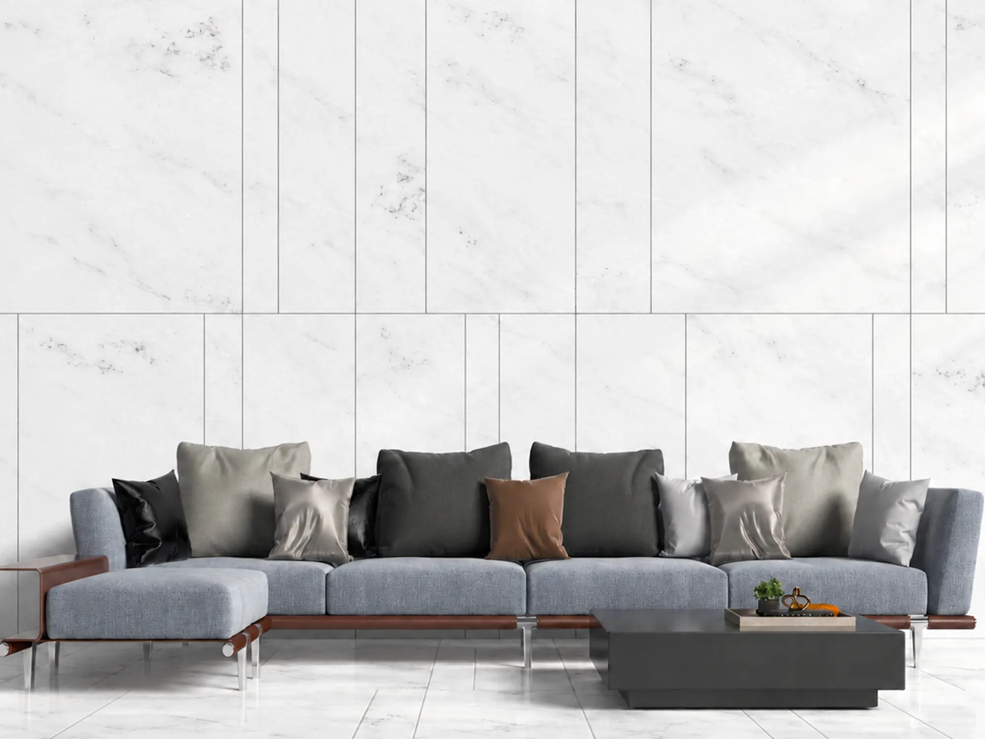 Mugla White marble wall and floor tiles in a living room with a gray sectional sofa and a dark rectangular coffee table.