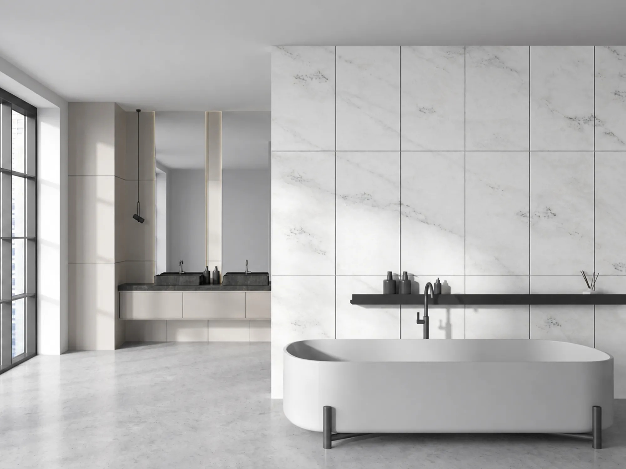 Mugla White marble tiled feature wall behind a freestanding bathtub, with delicate gray veining, a black shelf, and a black faucet.