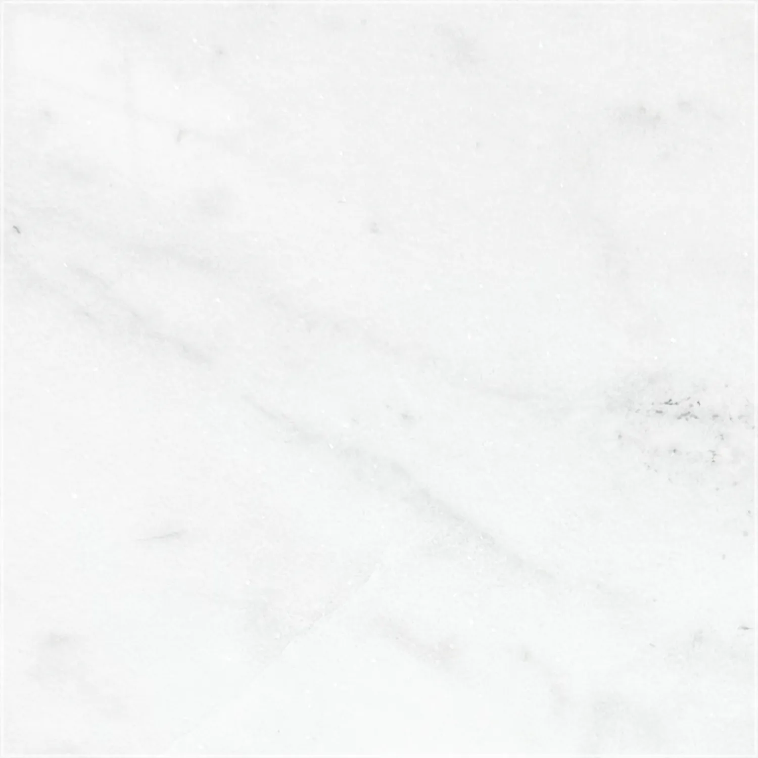 Polished Mugla White marble sample with a white background, subtle gray veining, and scattered darker gray markings.