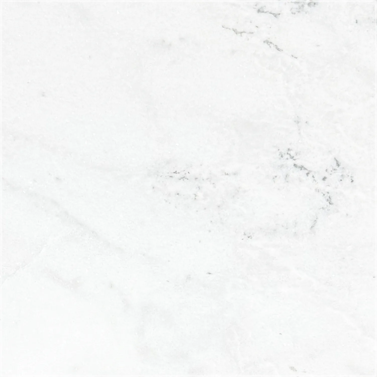 Brushed Mugla White marble sample with a white background, soft gray patterns, and fine darker gray veins.