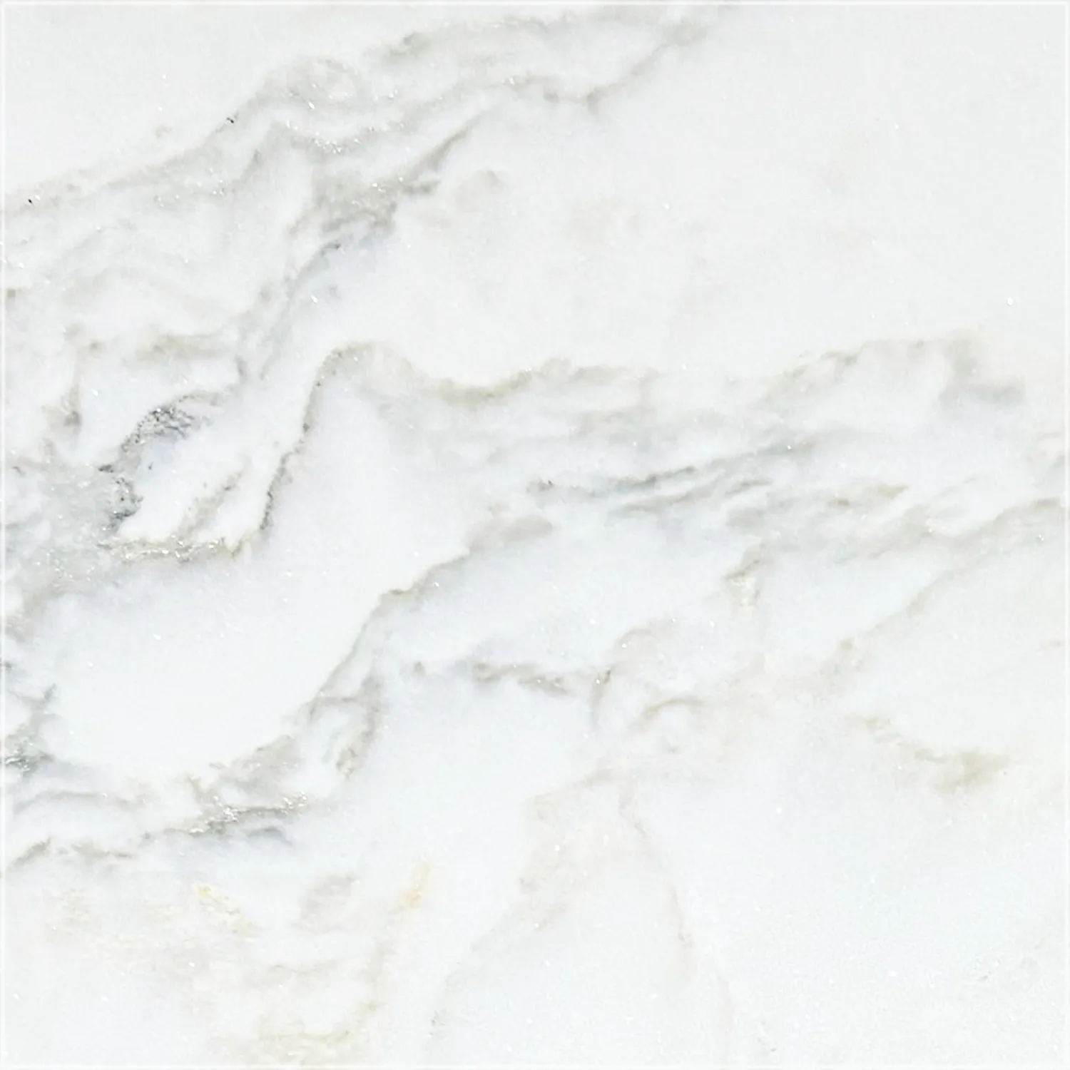 Brushed Calacatta Green marble sample with flowing gray veins, subtle green undertones, and warm ivory accents.