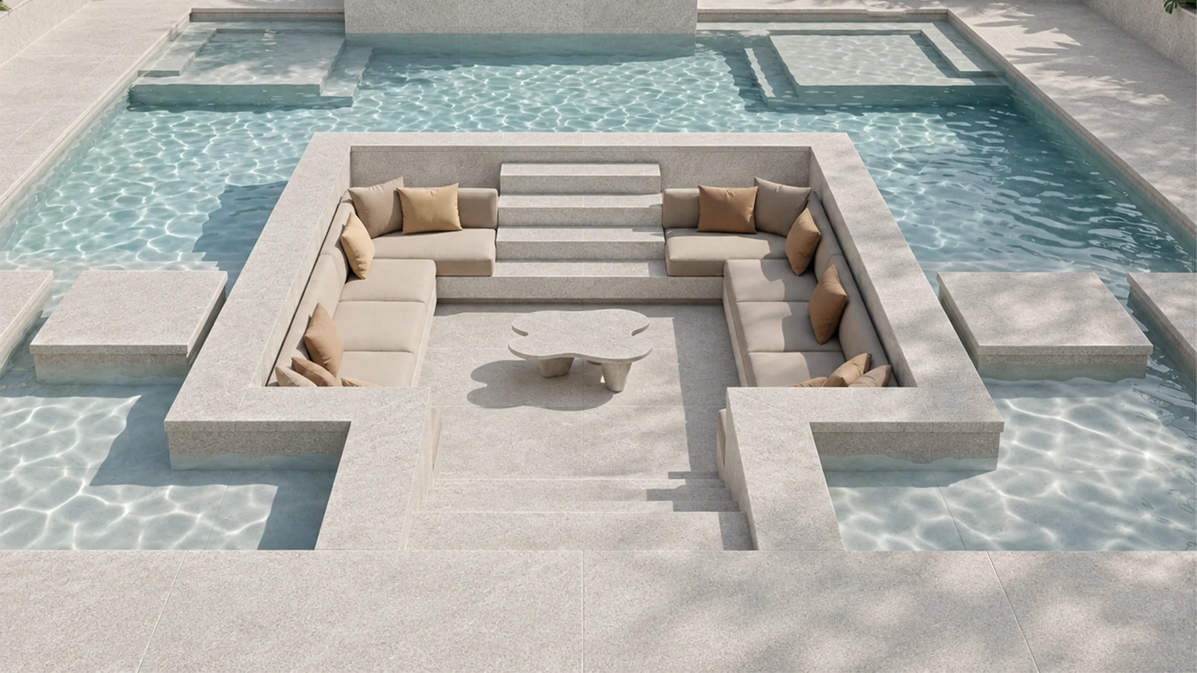 Light beige natural stone coping and wide steps leading to a sunken lounge surrounded by pool water.