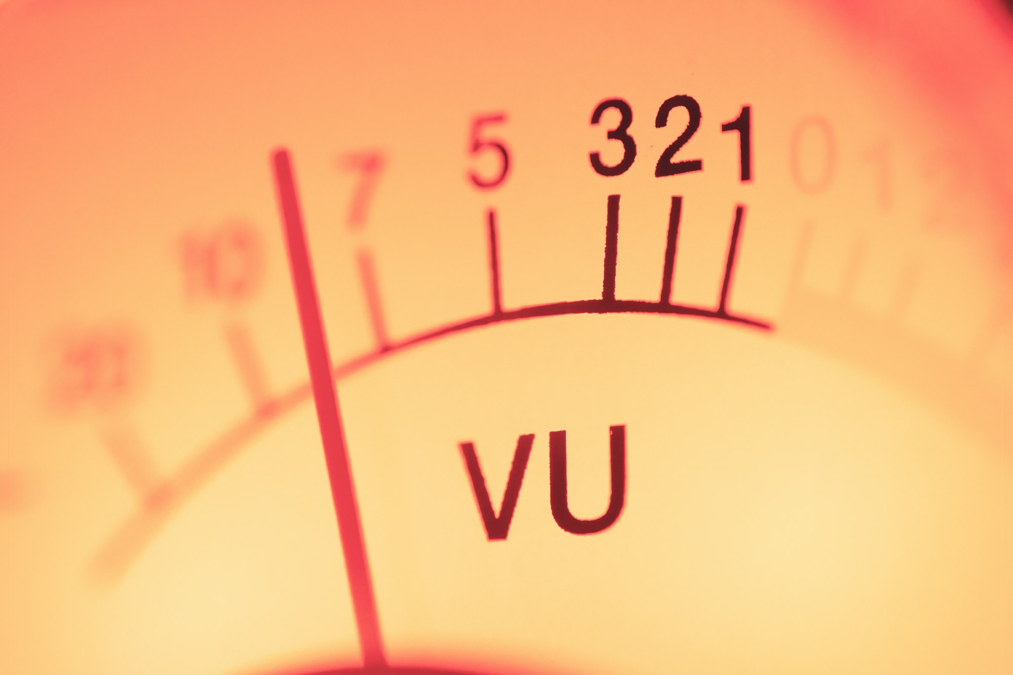 Analogue VU meter needle showing sound levels in decibels