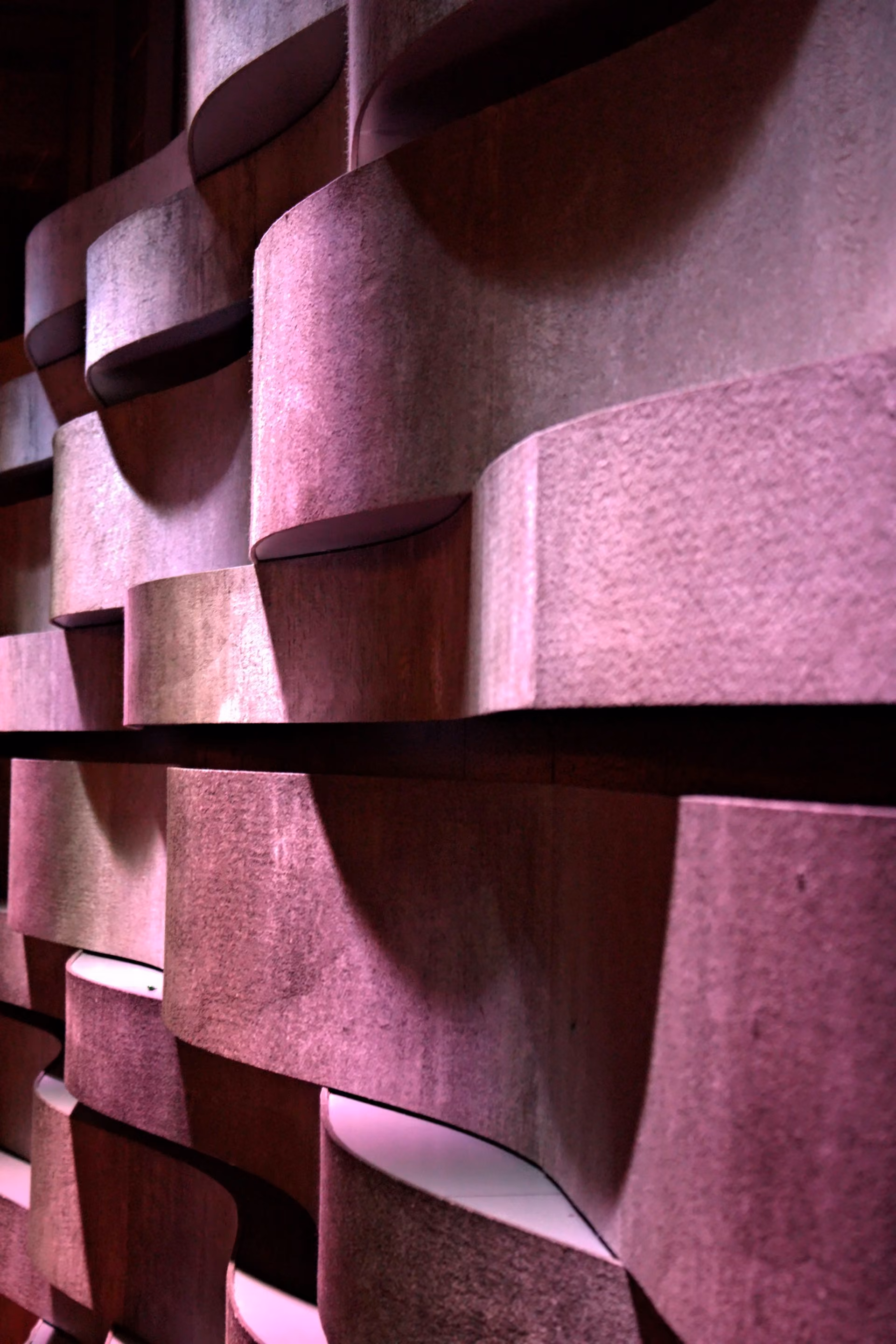 Sculpted purple PET felt acoustic wall panels in close up