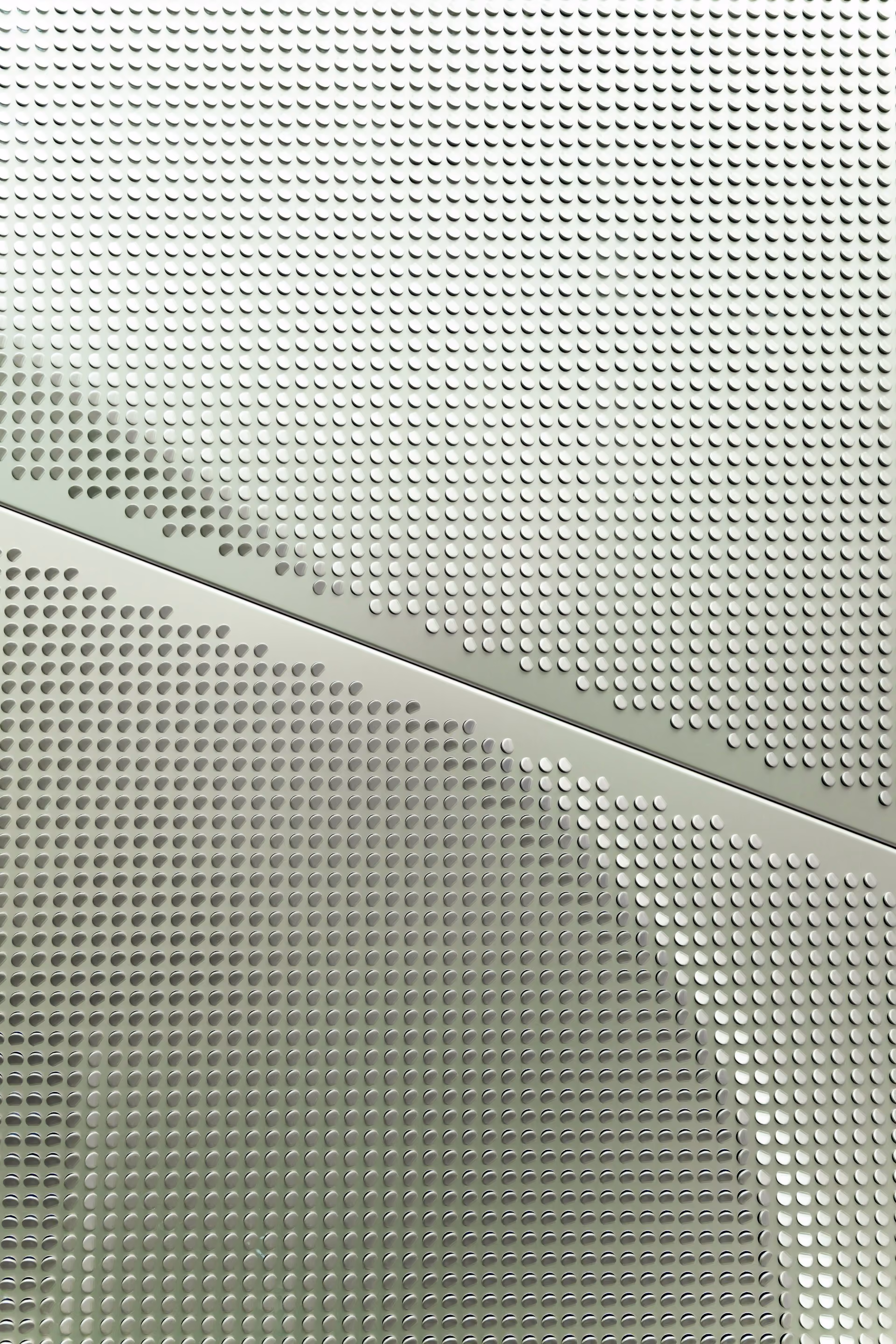 Microperforated Acoustic Panels: Solid Look, Real Absorption