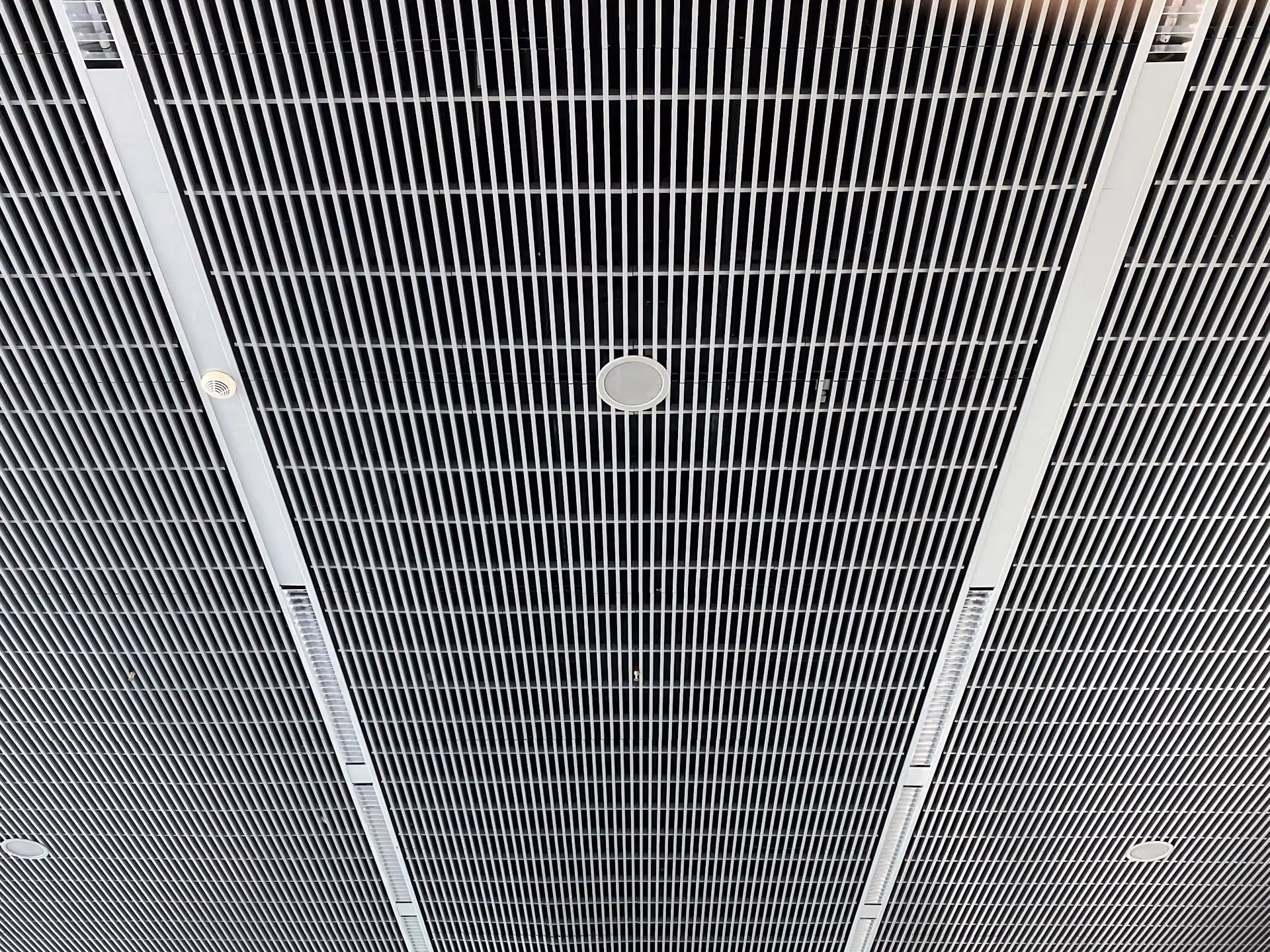 Linear metal slat acoustic ceiling seen from below