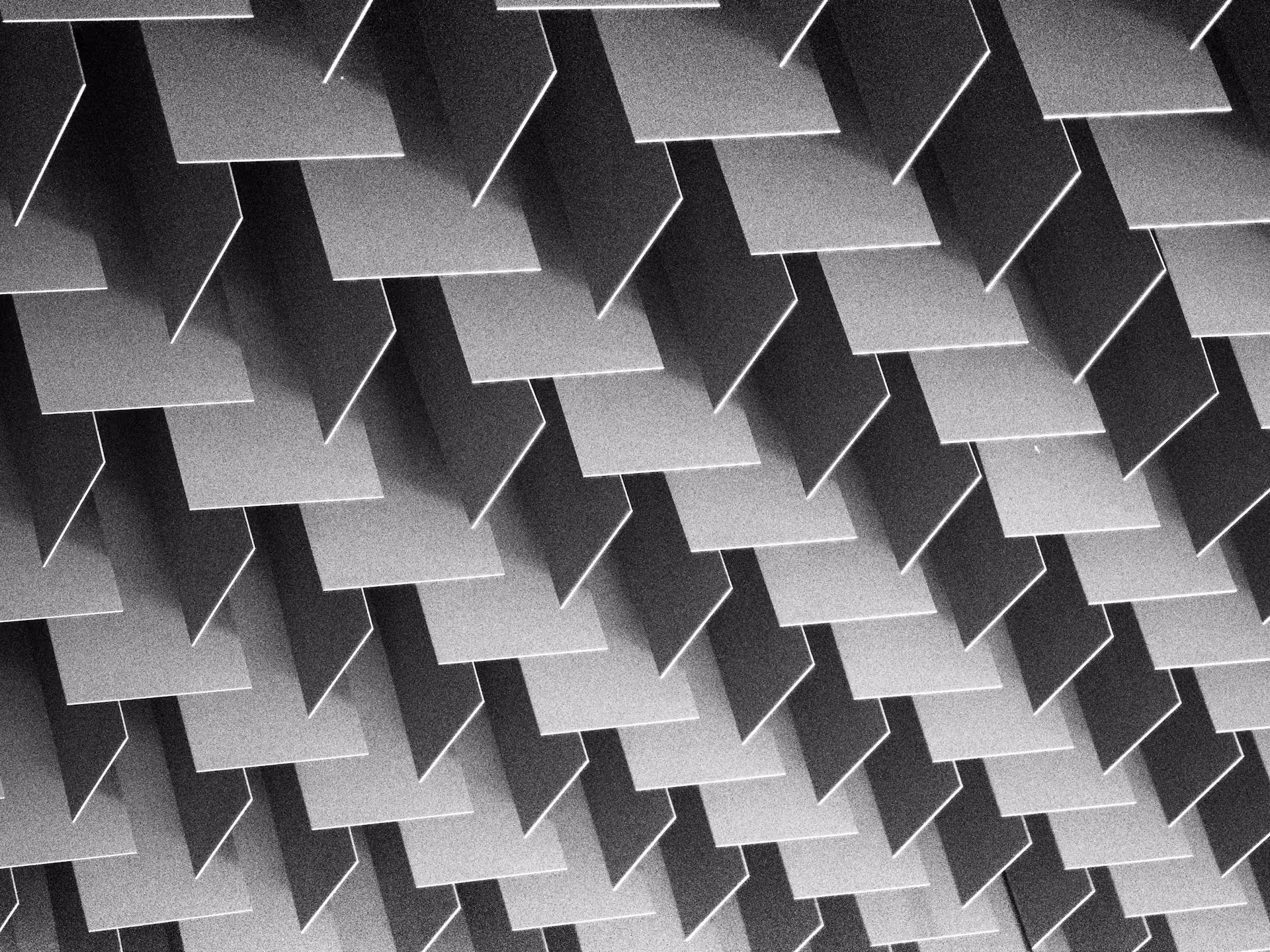 Grey sound-absorbing panels arranged in a repeating pattern across a surface
