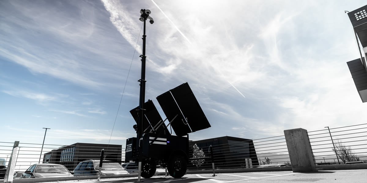 A unit with its mast raised and panels open against a clear sky.
