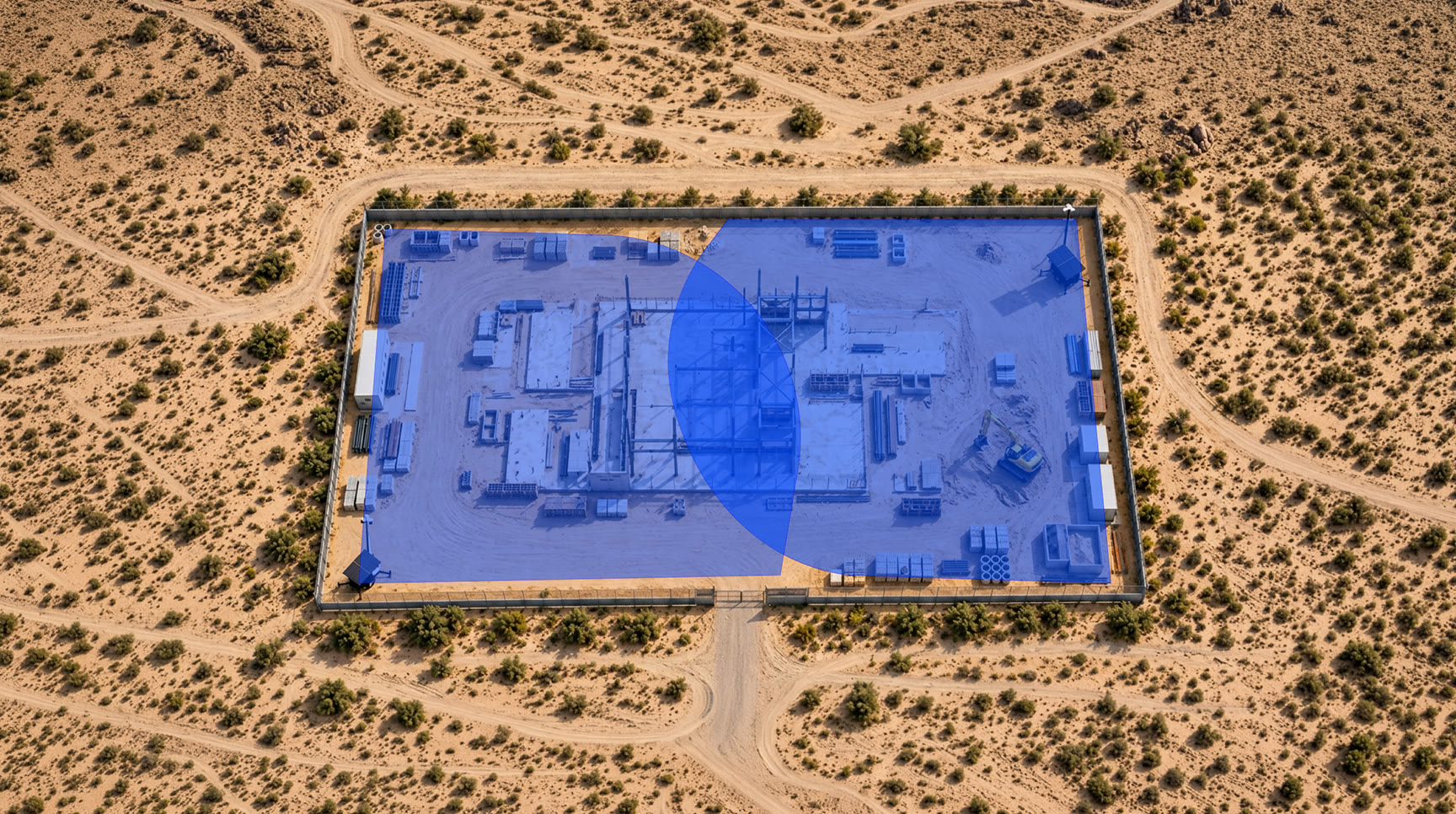 An aerial view of a fenced substation compound with the planned camera coverage shaded in blue across the site.