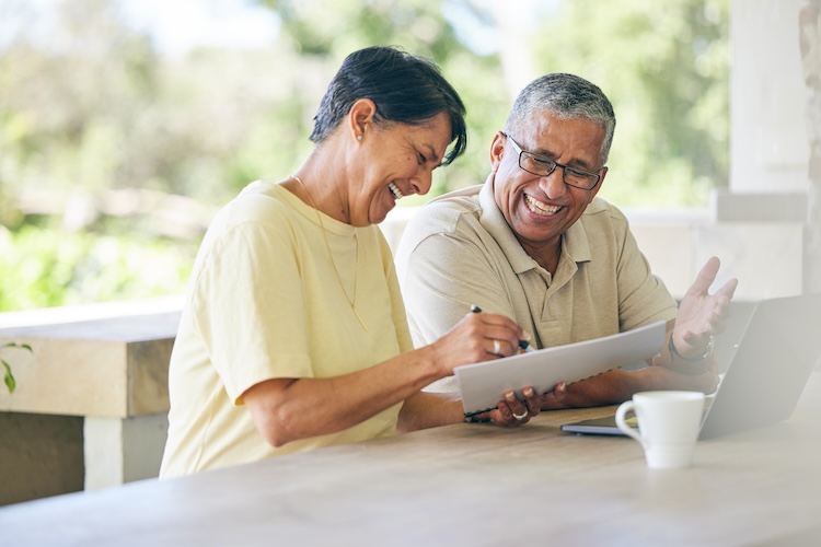 Man and woman looking at paper stock image