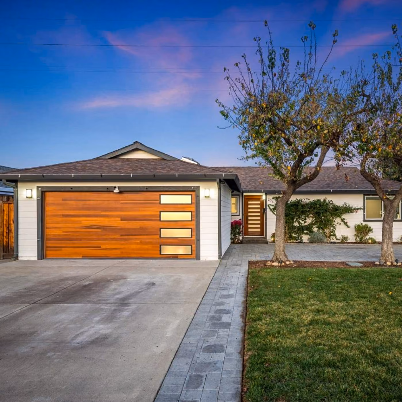 Front exterior with modern wood garage door at 2942 La Jolla Avenue in San Jose