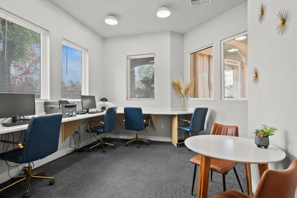 Business center with computers and desks