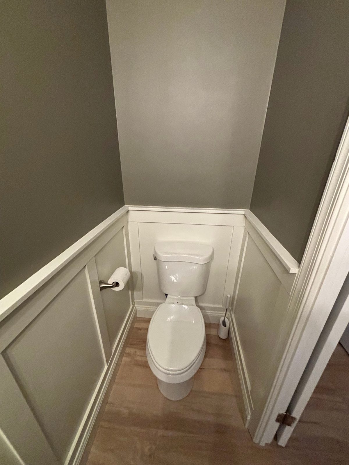 Finished powder room with wainscoting