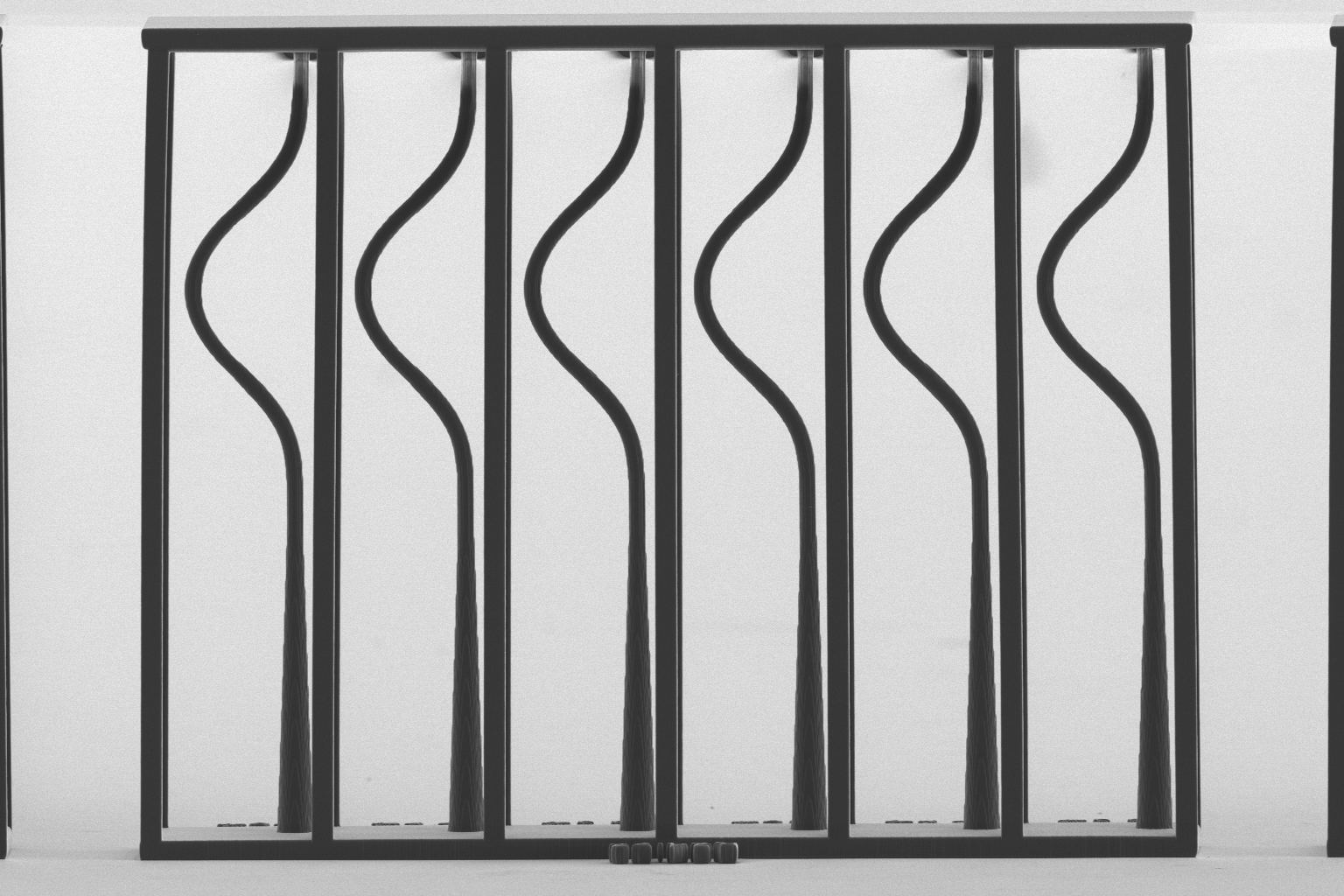 Scanning electron micrograph of a mode converter feeding a row of optimized S-bends between two rails.