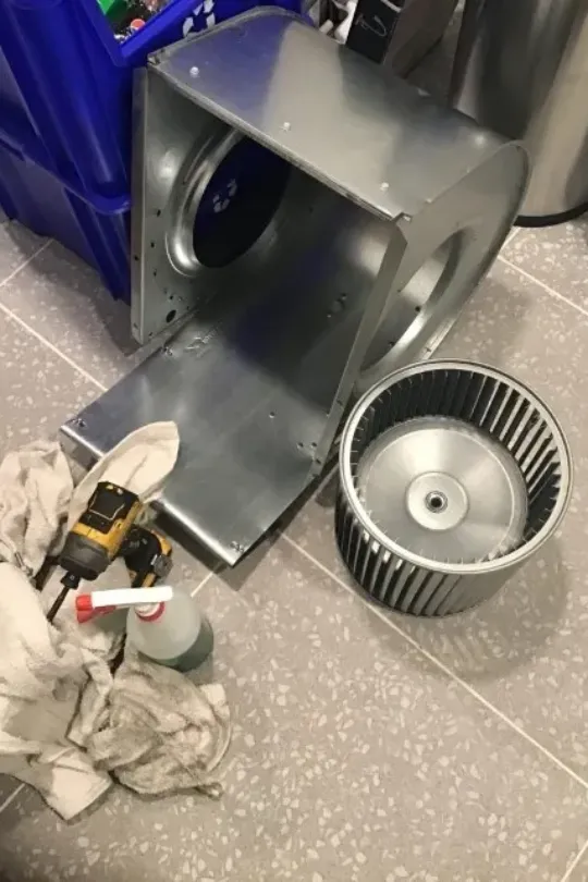 A furnace being deep cleaned.