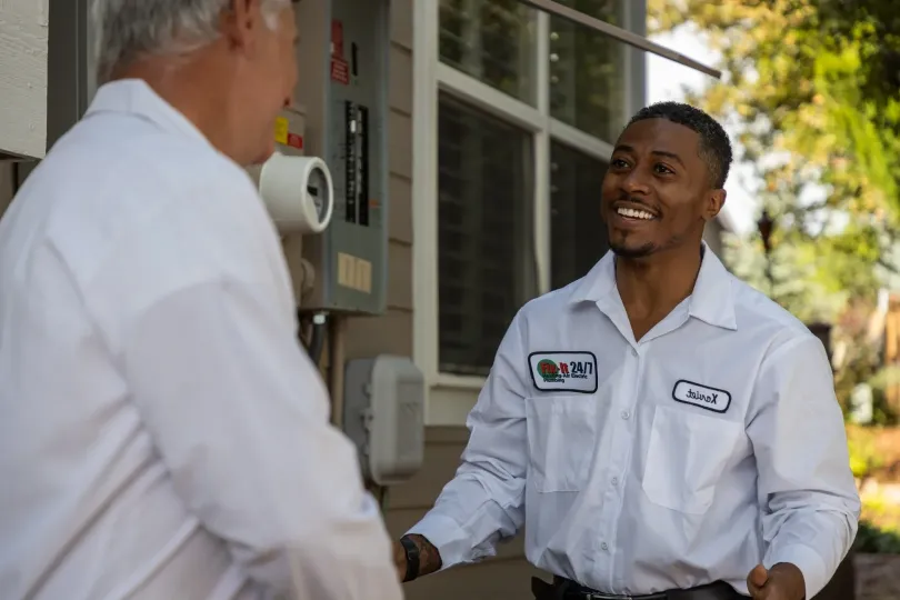 Two techs talking outside.