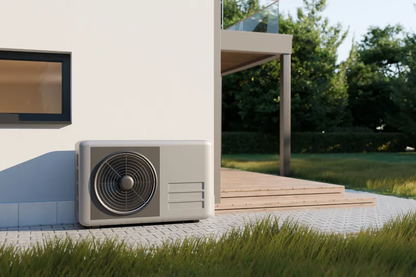 A heat pump outside of a house.