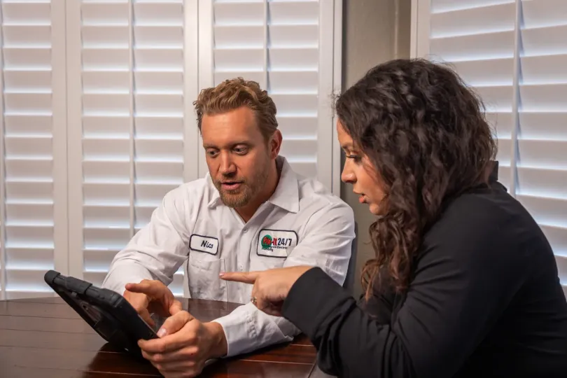 A homeowner discussing options with a technician.