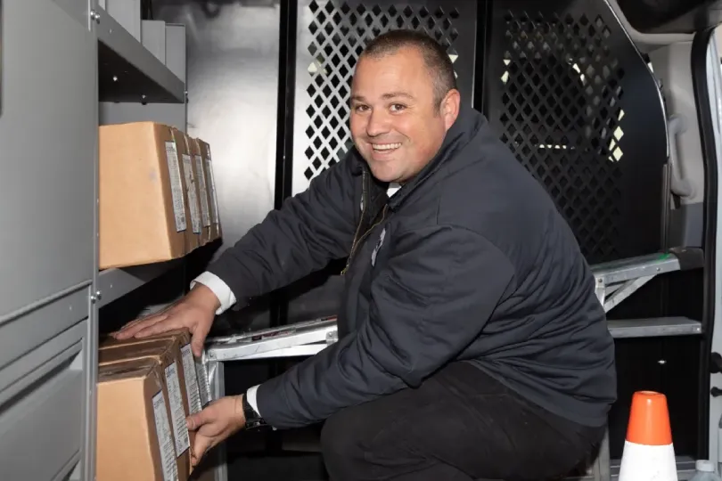 A technician in a stocked truck.