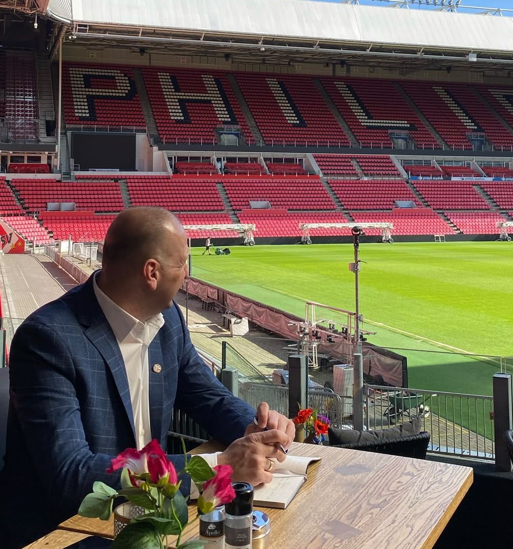 Nikola Virijević taking notes pitchside at the PSV Philips Stadion