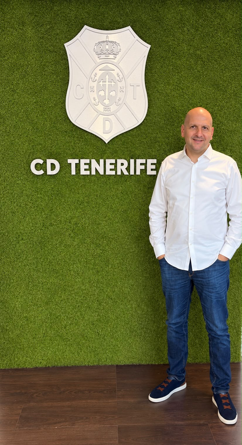Nikola Virijević at CD Tenerife in front of the club crest